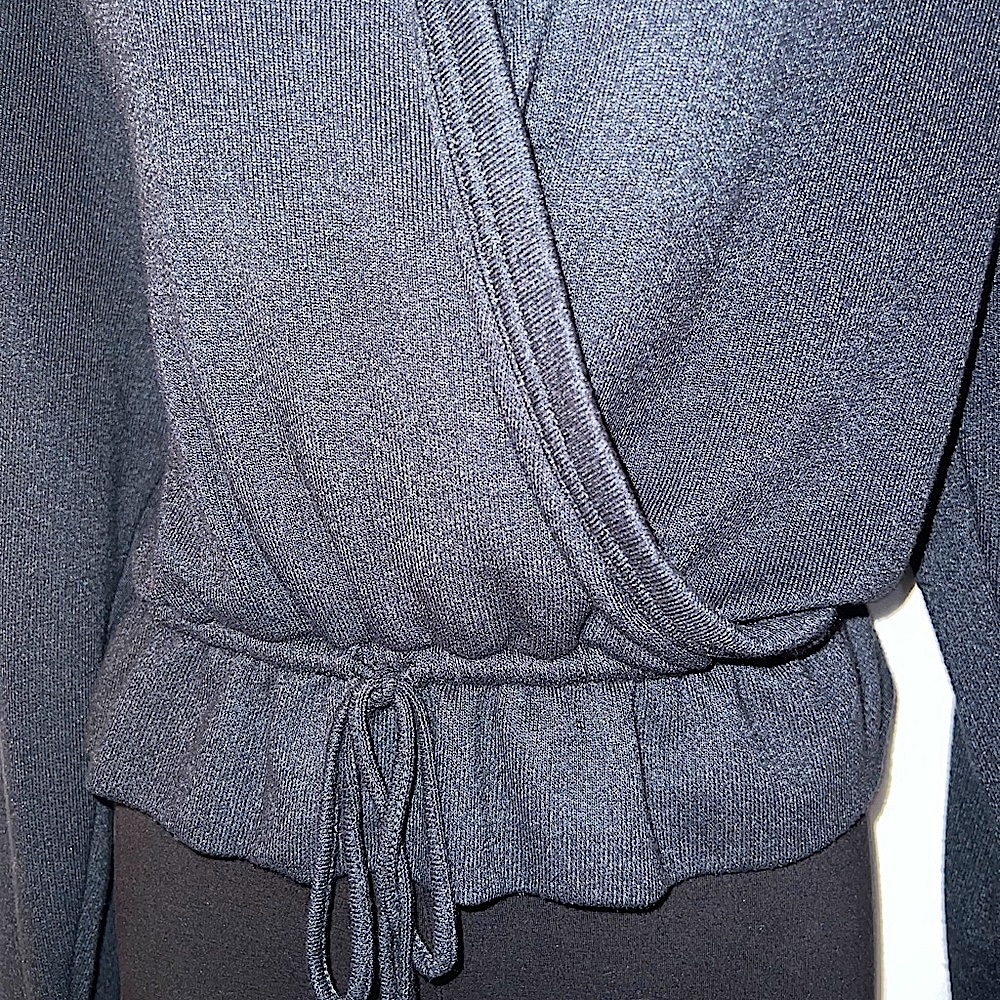 Charcoal peplum top. NWOT